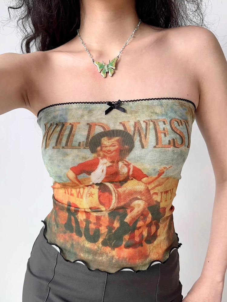 Woman wearing a graphic print strapless tube top with 'Wild West' text and imagery.