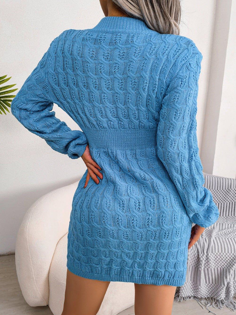 Back view of a woman wearing a blue cable knit long sleeve crew neck bodycon dress with a cinched waist.