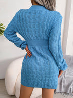 Back view of a woman wearing a blue cable knit long sleeve crew neck bodycon dress with a cinched waist.