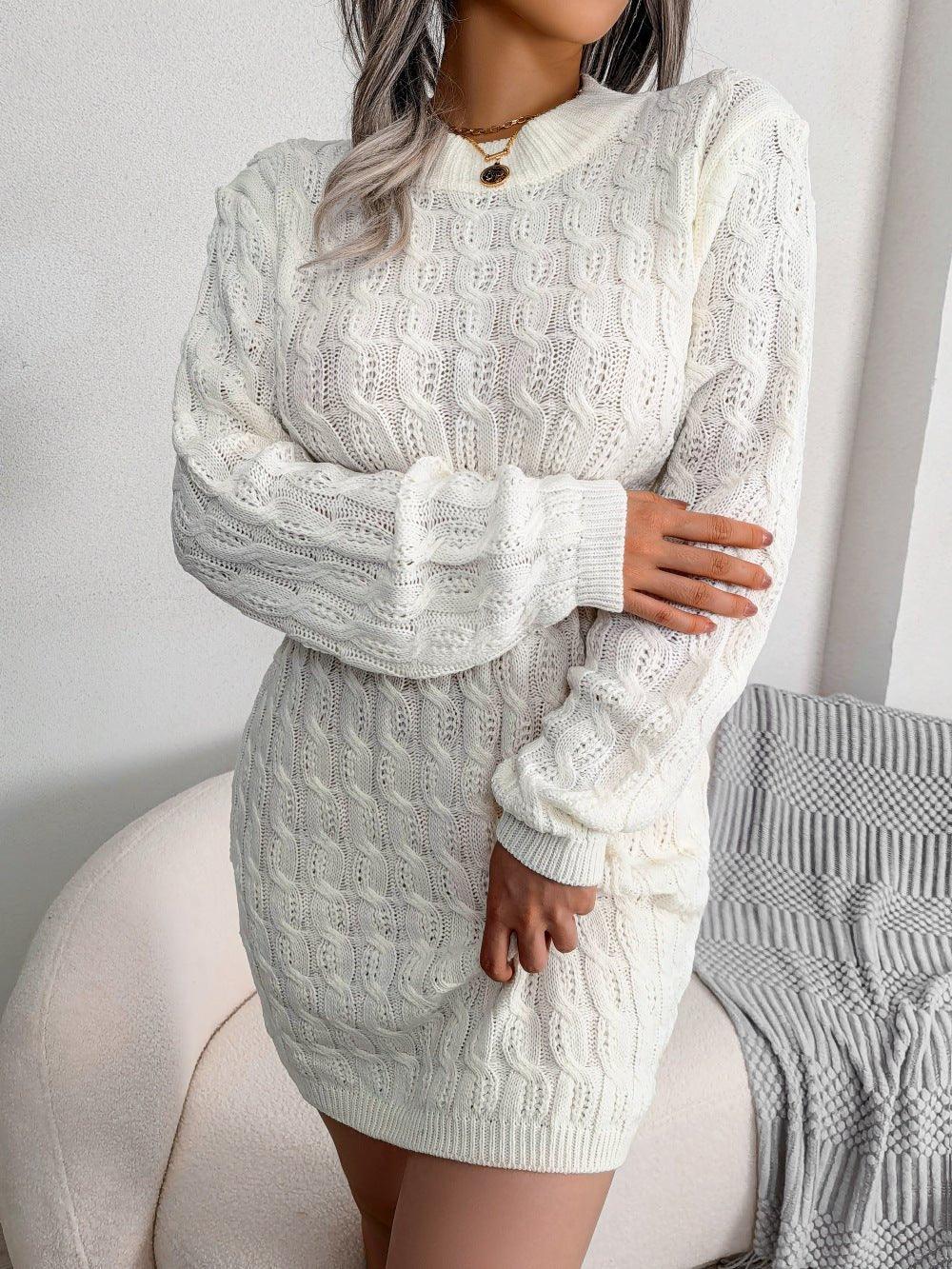 Woman wearing a white cable knit long sleeve crew neck bodycon dress with a cinched waist.