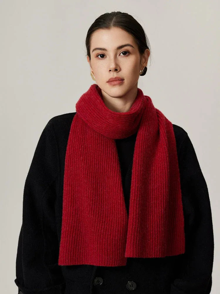 Woman wearing red ribbed knit scarf with black top Main image