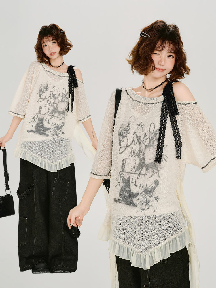 Model posing with a cream lace tunic and black wide-leg pants.