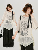 Model posing with a cream lace tunic and black wide-leg pants.