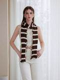 Woman wearing a long black and white striped knit scarf with ruffle edges - View 16 | WEUXS