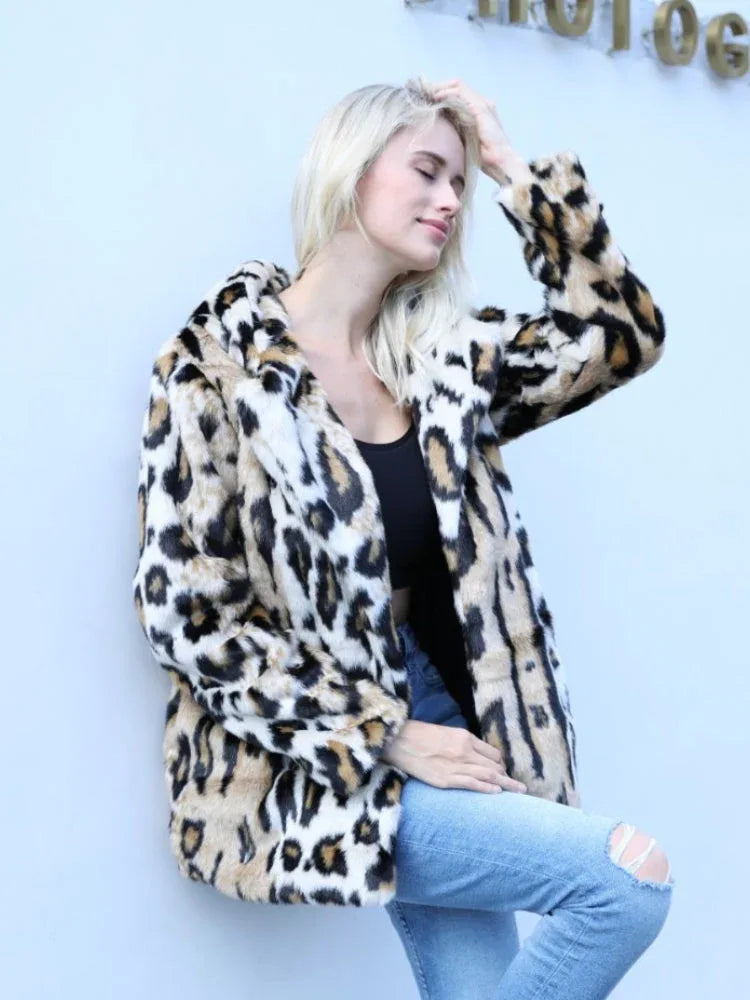 Woman posing in a leopard print faux fur jacket