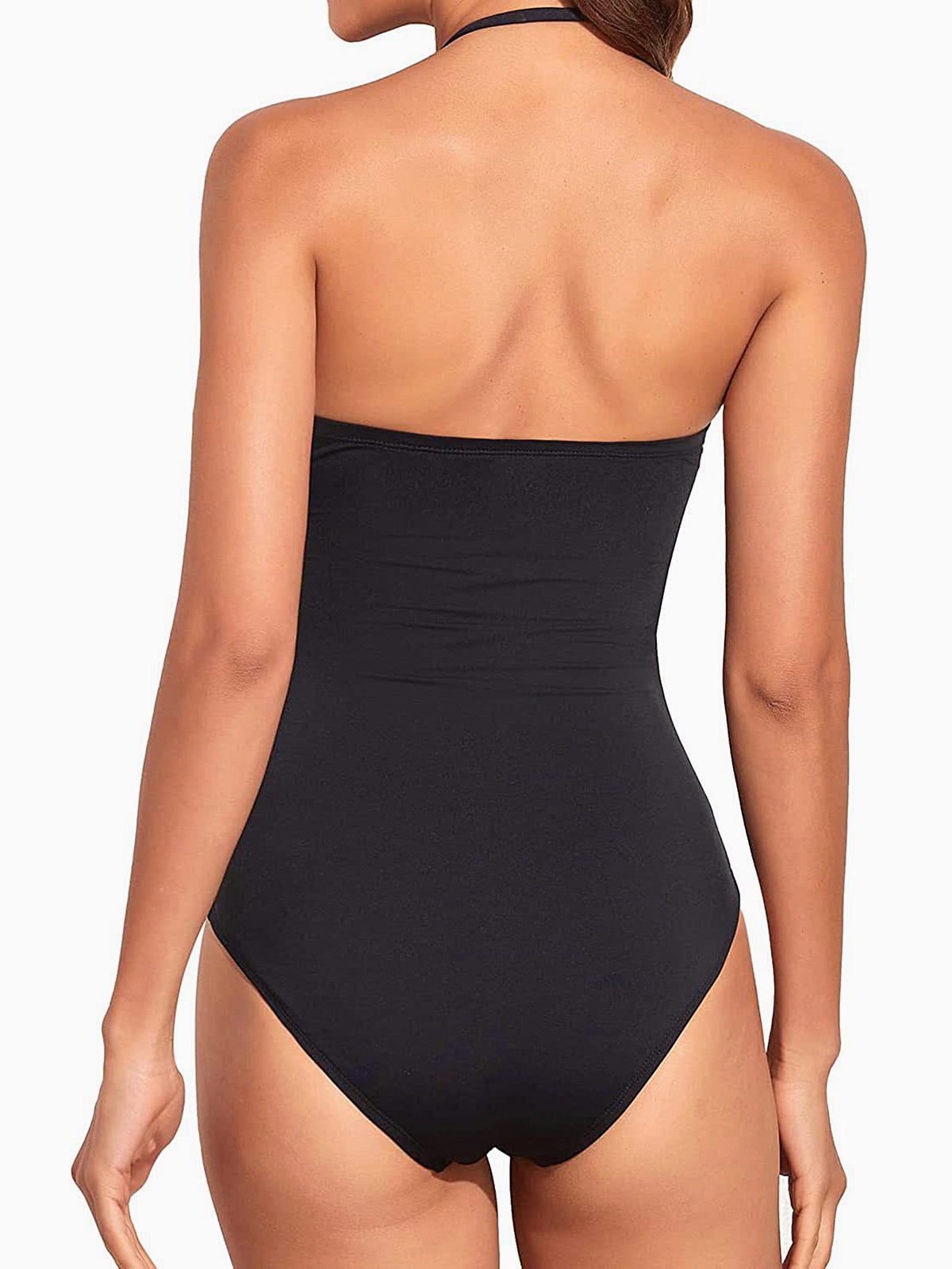 Back view of a woman in a black strapless one-piece swimsuit