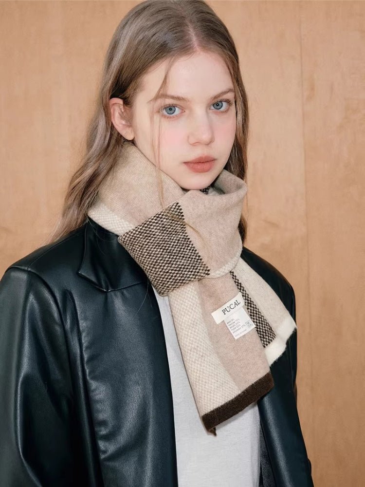 Model showcasing a stylish knit scarf with a colorblock pattern