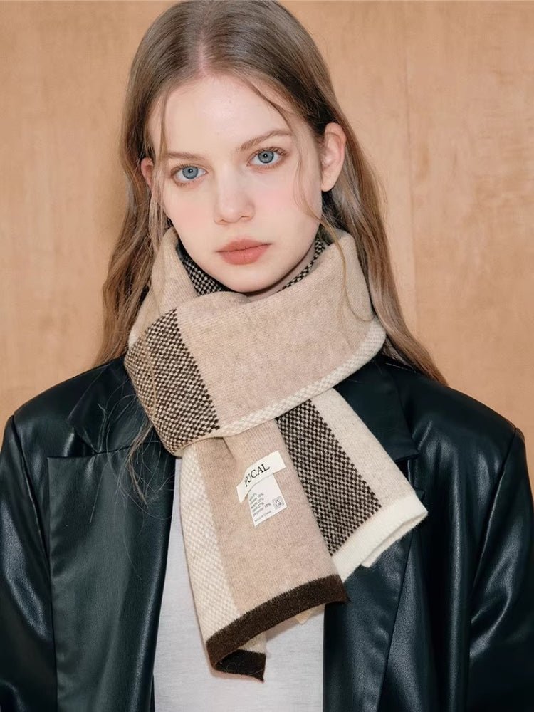 Woman wearing a beige and brown colorblock knit scarf