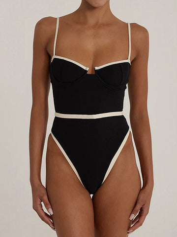 Front view of a black one-piece swimsuit with contrast trim and sweetheart neckline