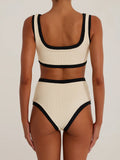 Back view of cream ribbed knit bikini set with black trim.