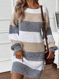 Woman in a beige, grey, and white striped knit sweater dress.