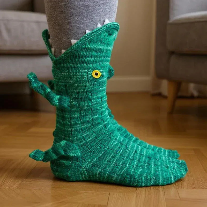 Green knitted dinosaur socks with white teeth and yellow button eyes Main image
