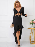 Front detail of a black maxi dress with a deep V-neckline and tie front