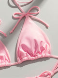 Close-up of pink bikini top with bow detail