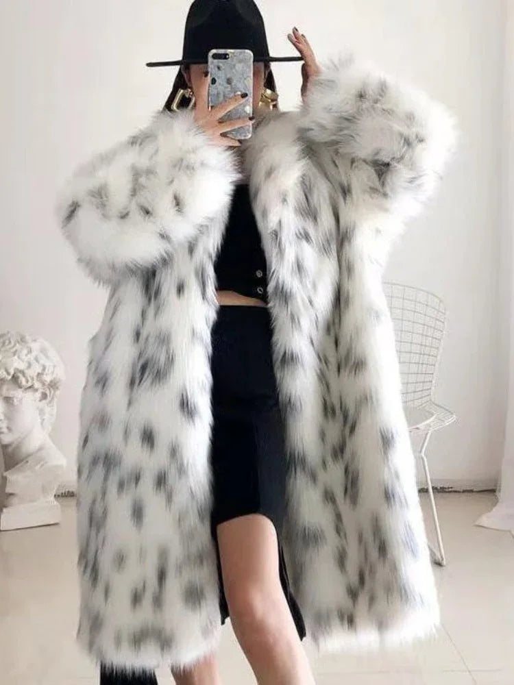 Woman wearing a long white faux fur coat with black leopard print and large lapels