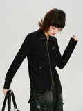 Close-up of the black knit jacket showing the ribbed turtleneck and zip detail.