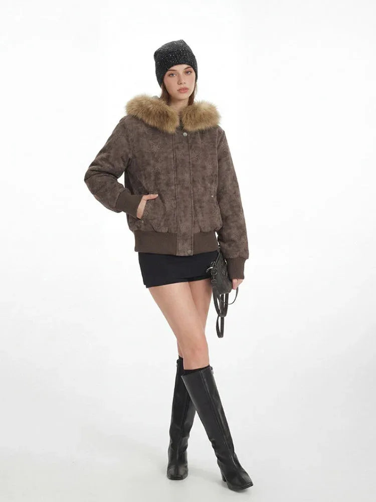 Woman in a brown star pattern bomber jacket with fur trim