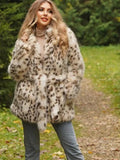 Woman wearing a spotted faux fur coat and jeans