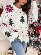 Close-up of the snowflake and Christmas tree pattern on a knit sweater.
