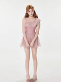 Full body shot of the model in the pink ruffled dress