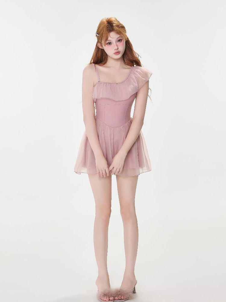 Full body shot of the model in the pink ruffled dress