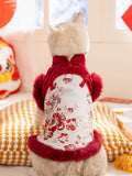 Rear view of a cat wearing a red and white traditional Chinese inspired pet vest with faux fur trim and floral embroidery.