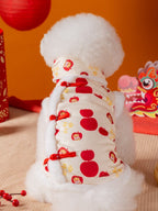 Rear view of a Bichon Frise dog in a cream pet vest with apple and character prints and red knot buttons