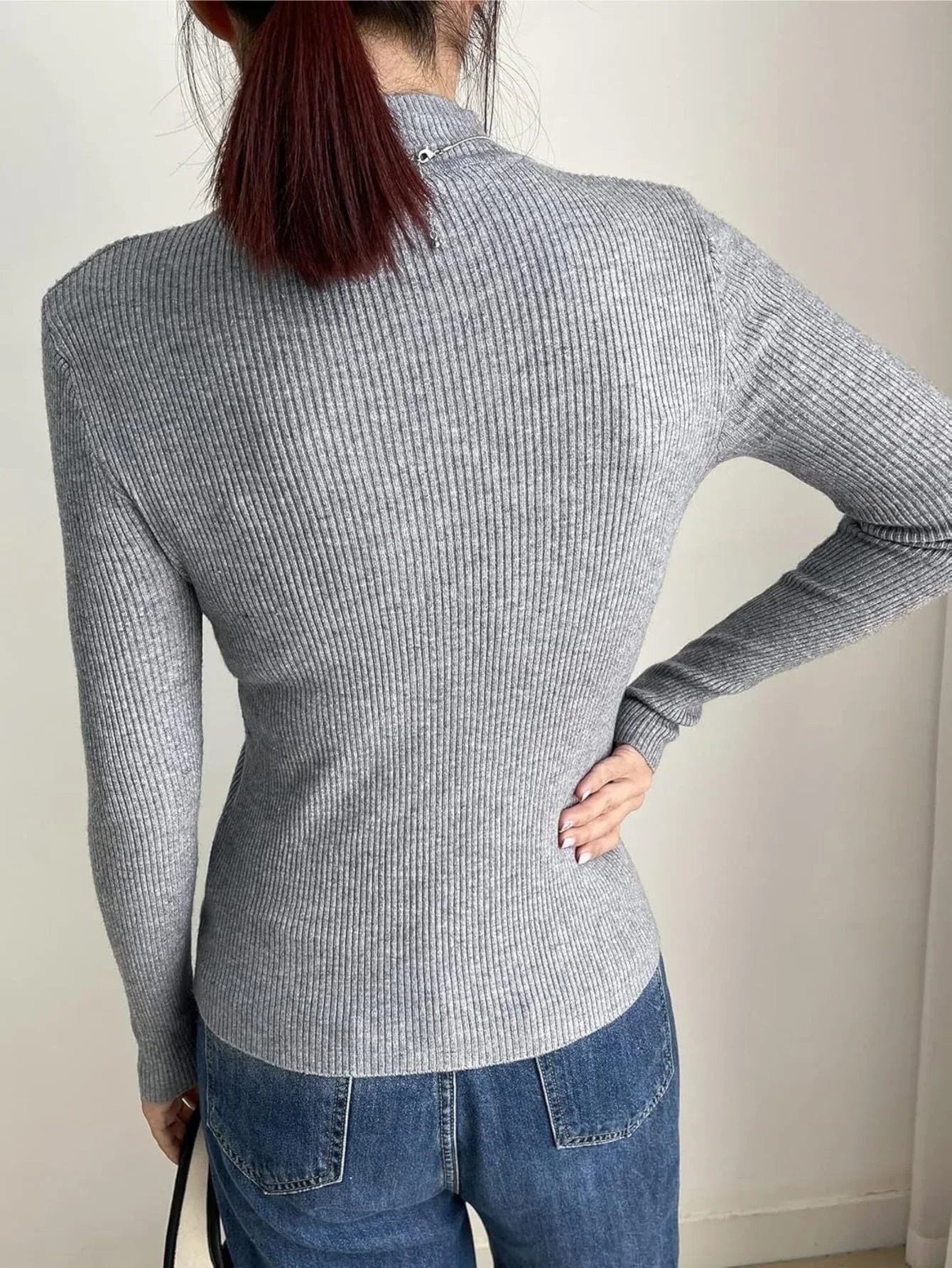 back view of grey mock neck ribbed knit sweater