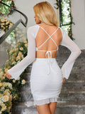 Back view of a white mesh dress with an open tie-back design