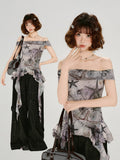 Model wearing the off-the-shoulder top with black wide-leg pants