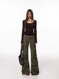 Full body shot of model wearing the brown long-sleeve top and cargo pants