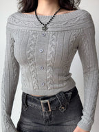 Grey cable knit cropped sweater with off-the-shoulder neckline and button detail