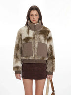 Front view of a woman in a patterned faux fur jacket