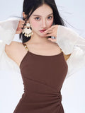 Close-up of the brown ribbed knit mini dress showing square neckline and adjustable straps