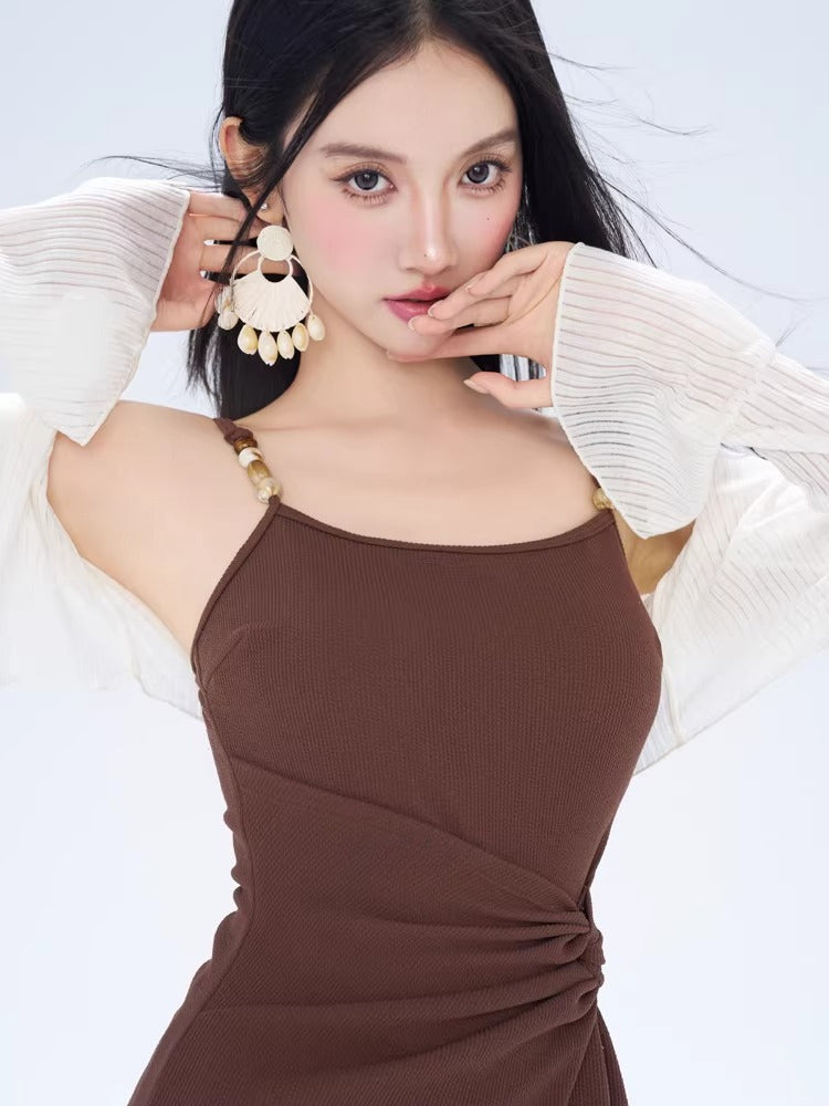 Close-up of the brown ribbed knit mini dress showing square neckline and adjustable straps