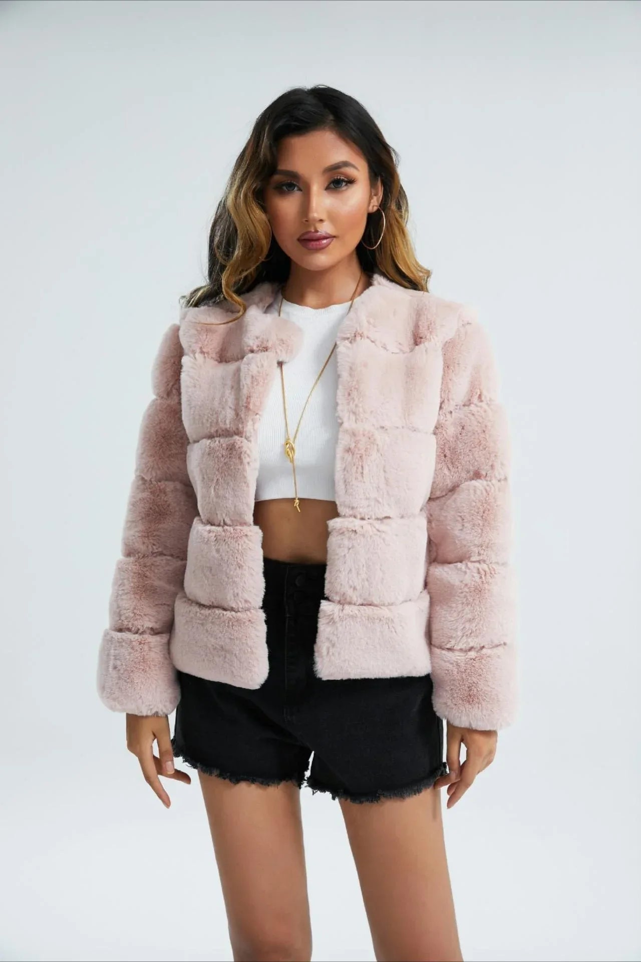 Woman wearing a pink faux fur paneled jacket Main image