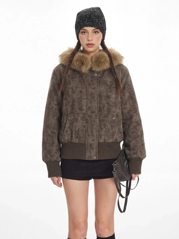 Front view of a woman in a textured brown bomber jacket