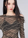 Close-up of the sheer striped fabric of the cover-up