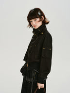 Side view of black bomber jacket with utility pockets