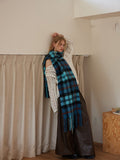 Plaid scarf in blue tones with fringe details