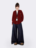 Woman modeling a casual red knit jacket with a zipper and embroidered tiger graphic.