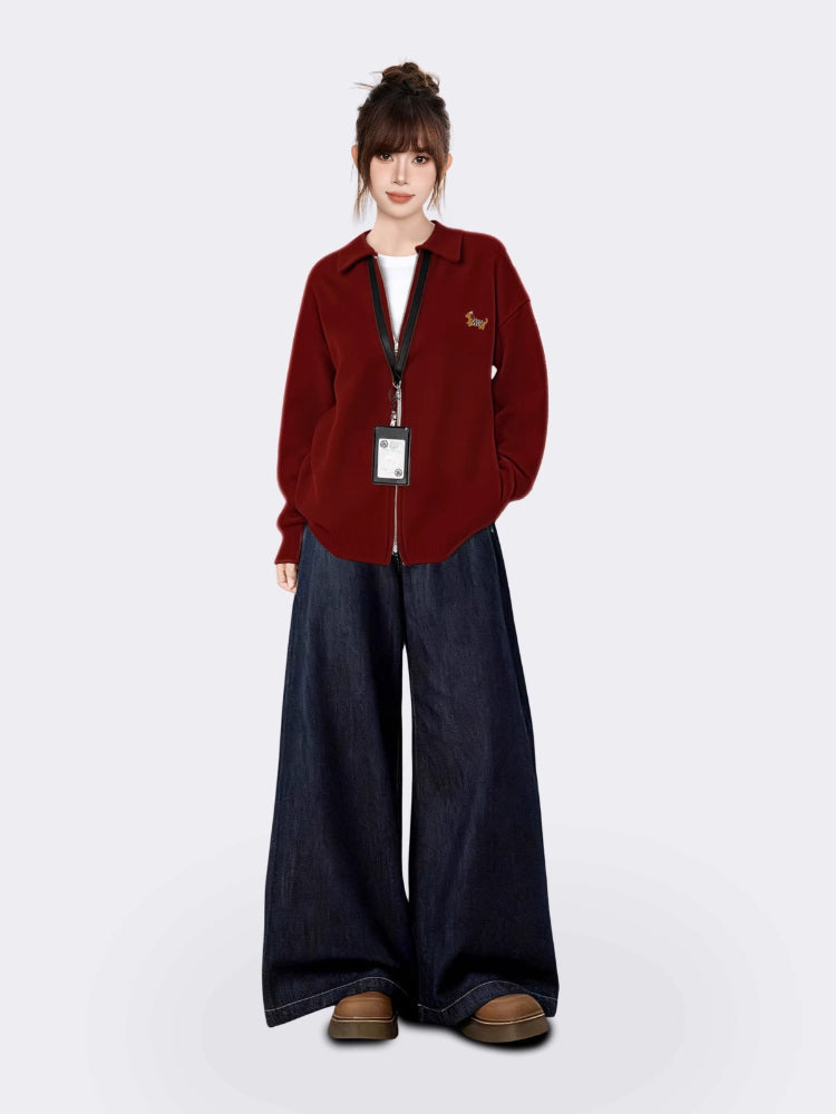 Woman modeling a casual red knit jacket with a zipper and embroidered tiger graphic.