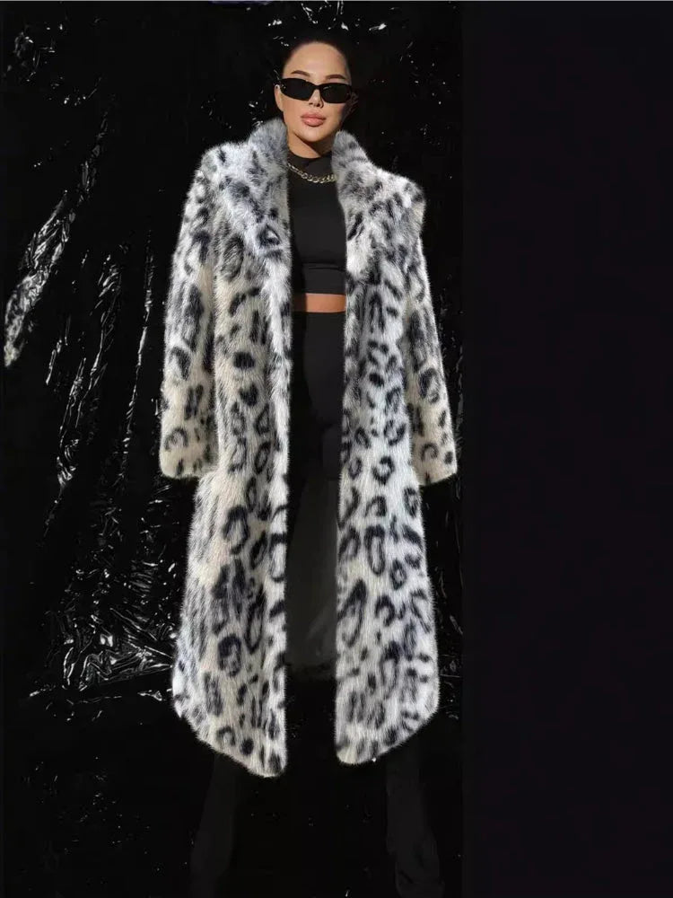 woman wearing a long faux fur coat with a black and white animal print Main image