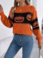 Detail of the black stripe with Jack-o'-lanterns on the sweater sleeve.