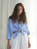 Woman wearing a white oversized cotton button down shirt - View 12 | WEUXS