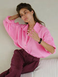Woman wearing a white oversized cotton button down shirt - View 16 | WEUXS
