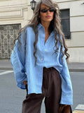 Woman wearing a white oversized cotton button down shirt - View 10 | WEUXS