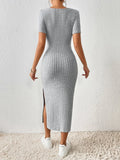 Back view of a grey ribbed knit midi dress with short sleeves
