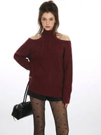 Close-up of the neckline on a burgundy cold shoulder halter neck sweater