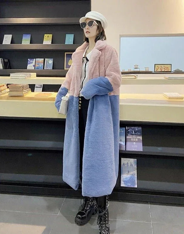 Woman wearing a pink and blue colorblock faux fur coat